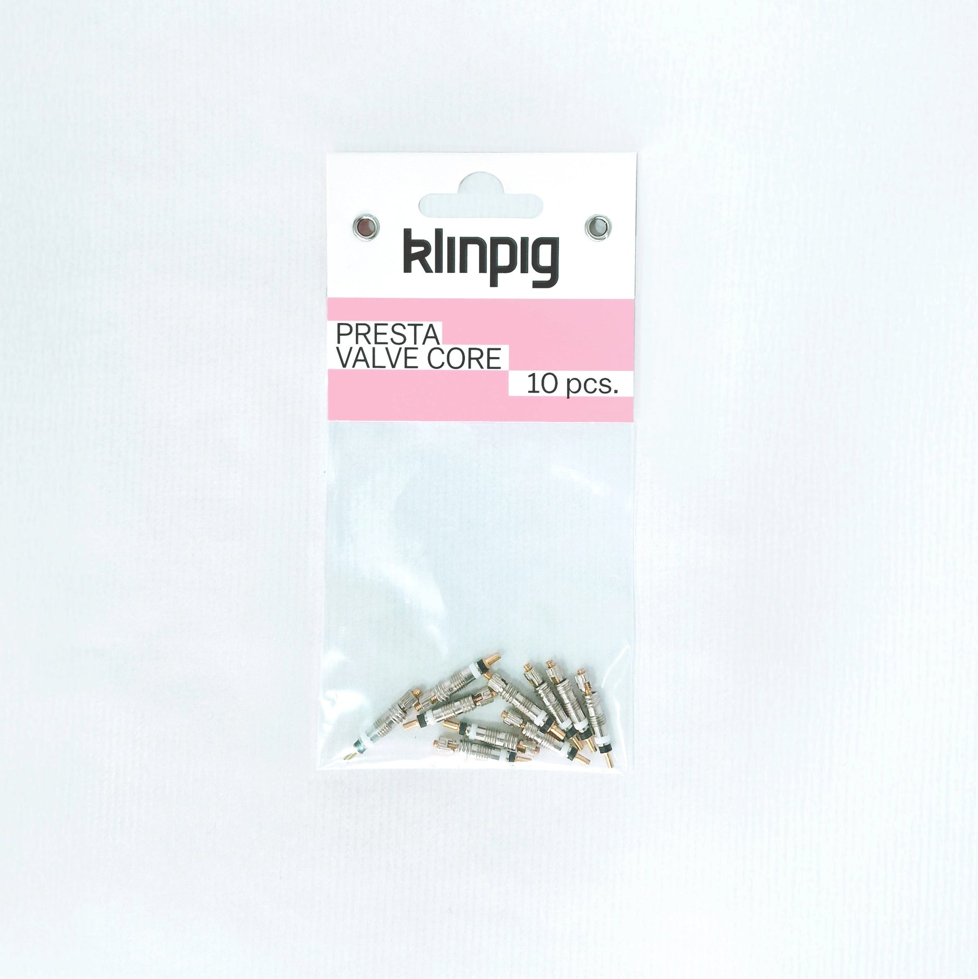 presta valve core 10 pcs. 10 piezas klinpig sobre paquete k l i n p i g rosa fondo blanco